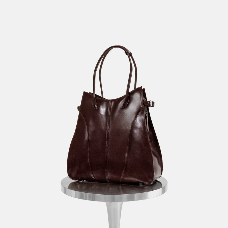 KIMIAS burgundy leather carryall on a white background